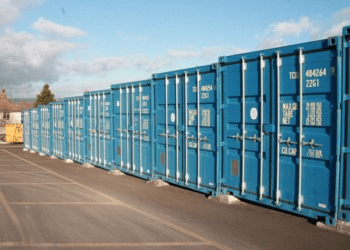 A row of blue storage containers at Storage Factory Glastonbury