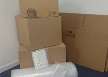 Cardboard boxes, tape and bubble wrap